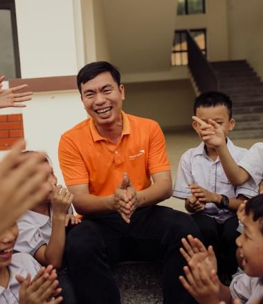 World Vision Vietnam staff with children